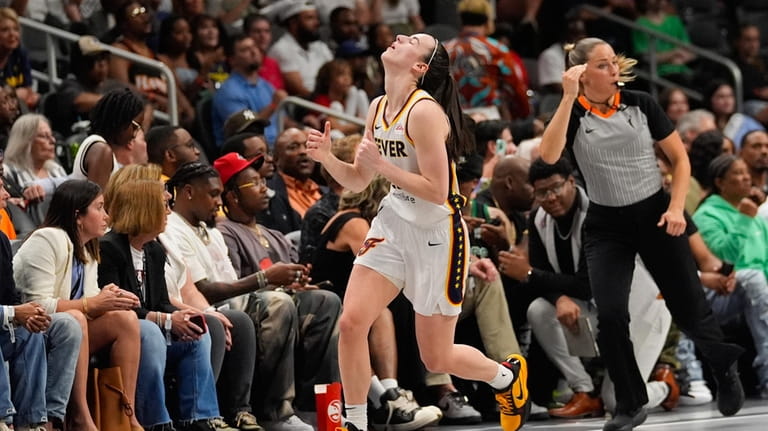 Indiana Fever guard Caitlin Clark reacts after missing a shot...
