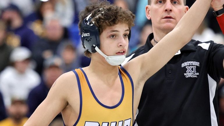 Shoreham-Wading River's Gavin Mangano wins the 110-pound weight class of...