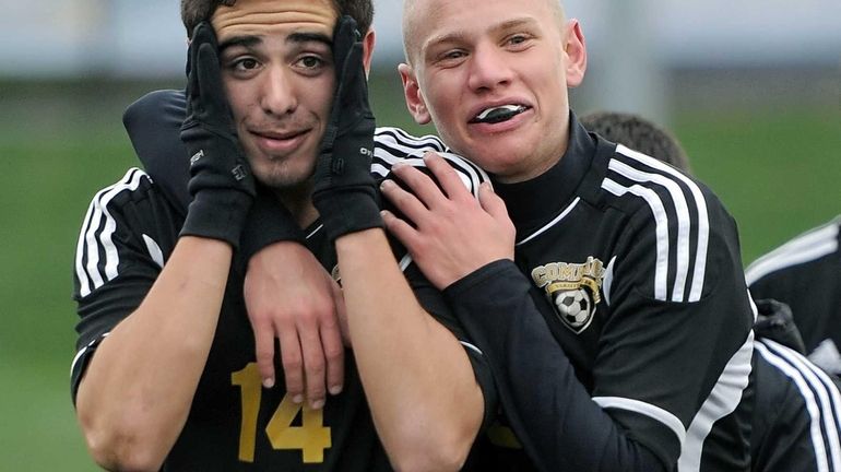 Commack's Gene Sicoli and Mike Pallonetti celebrate their championship win...