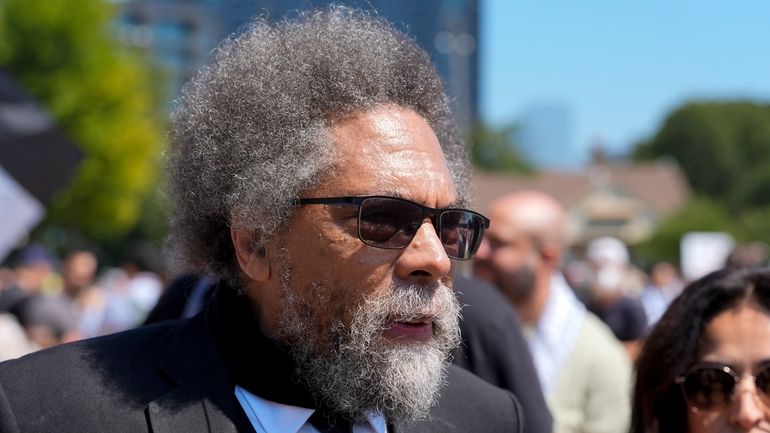 Progressive activist Cornel West watches a demonstration prior to a...