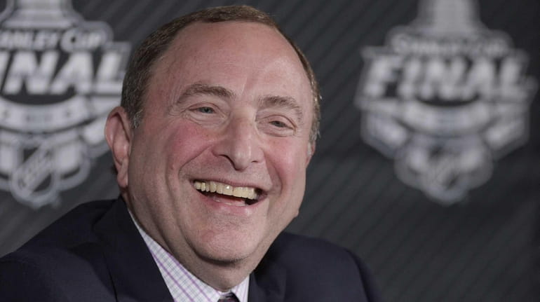 NHL commissioner Gary Bettman talks during a news conference before...