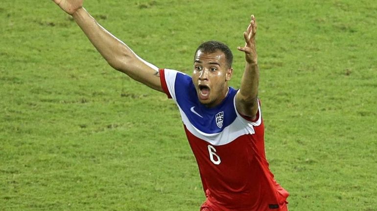 The United States' John Brooks celebrates scoring his side's second...