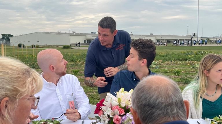 Greg Sigelmier, 40, speaks to attendees at the dinner party...