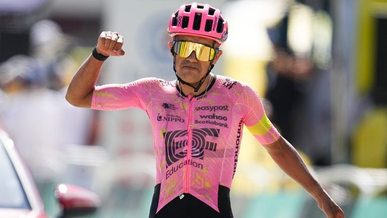 Ecuador's Richard Carapaz celebrates as he crosses the finish line...