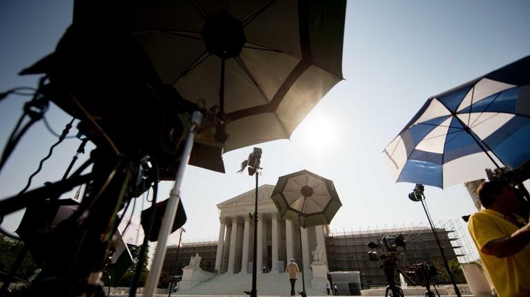 Members of the media camp outside the US Supreme Court...