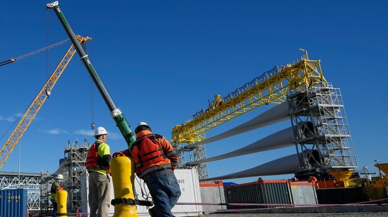 A generator and its blades are prepared for transport to...