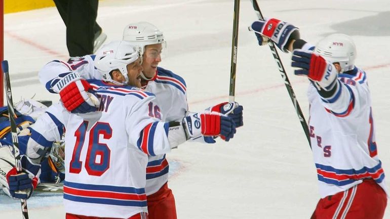 The Rangers' Sean Avery, left, Derek Stepan, center, and Marian...