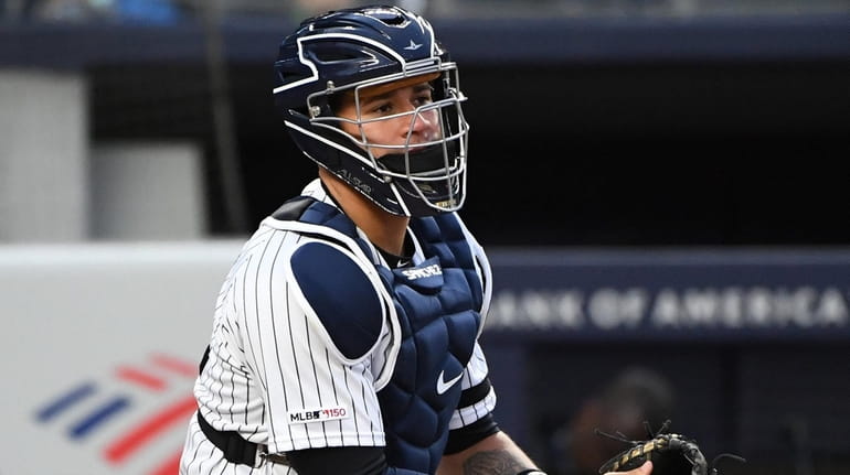 Yankees catcher Gary Sanchez looks on against the Orioles during...