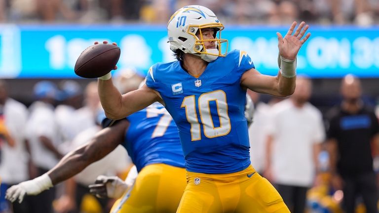 Los Angeles Chargers quarterback Justin Herbert (10) passes against the...