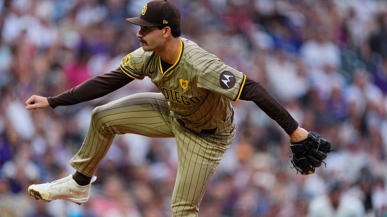 San Diego Padres starting pitcher Dylan Cease works against the...