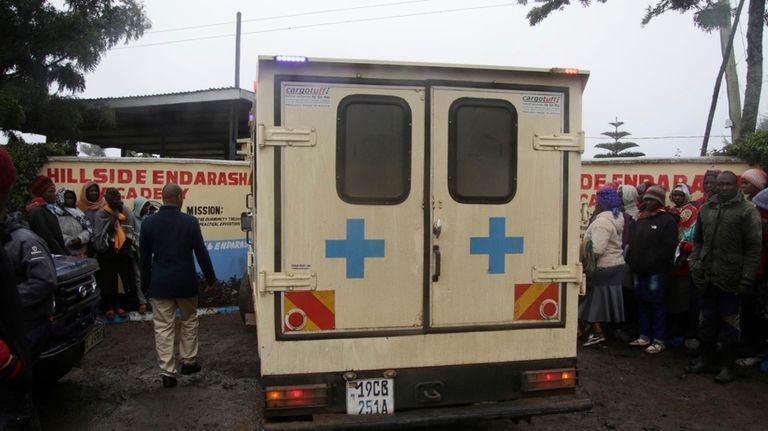 An ambulance drives inside the Hillside Endarasha Primary school following...