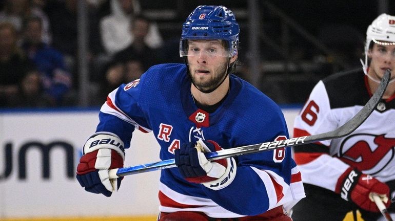 Rangers defenseman Zac Jones skates against the Devils during the...