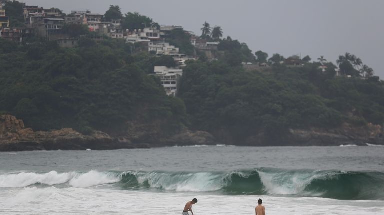 Tourists swim in Acapulco, Mexico, Oct. 24, 2023. Hurricane Otis...