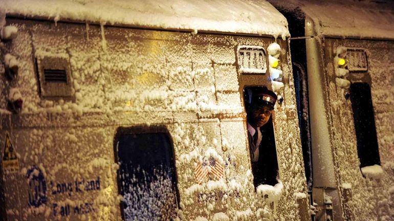 An LIRR conductor makes sure all is clear before leaving...