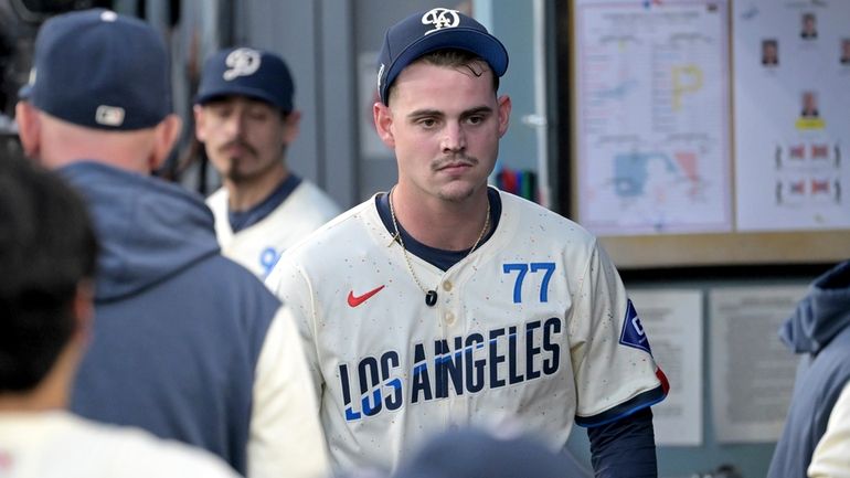 Los Angeles Dodgers starting pitcher River Ryan walks through the...