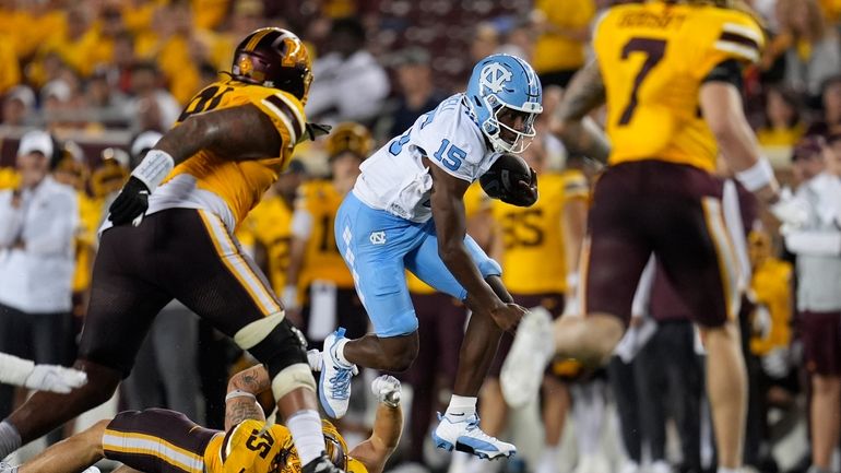 North Carolina quarterback Conner Harrell (15) runs with the football...