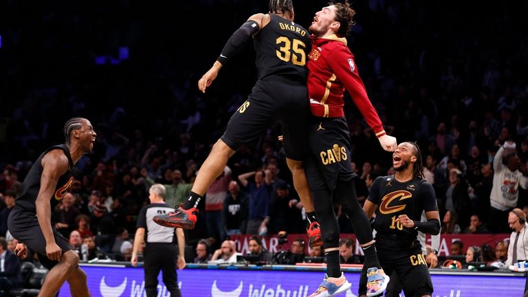 Cleveland Cavaliers forward Isaac Okoro (35) and forward Cedi Osman,...