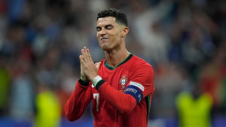 Portugal's Cristiano Ronaldo reacts after scoring in penalties shootouts during...