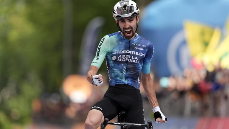 France's Valentin Paret-Peintre celebrates winning the 10th stage of the...