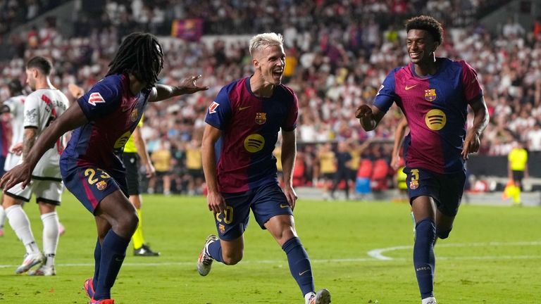 Barcelona's Dani Olmo, centre, celebrates after scoring his side's second...