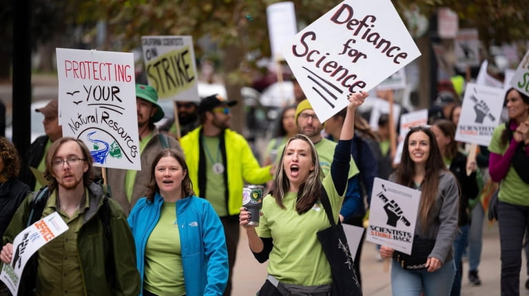 Striking members of the California Association of Professional Scientists march...