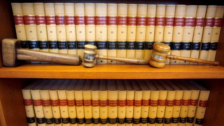 FILE-- Gavels and law books are shown, July 14, 2010...