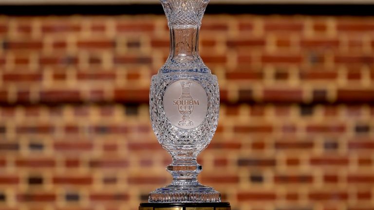 The Solheim Cup is shown during team portraits prior to...