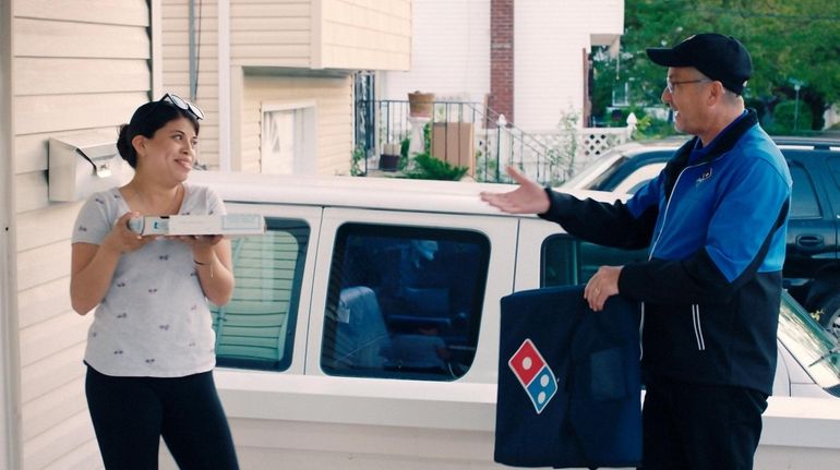 Wyandanch Domino's franchisee John Hall delivers a surprise pizza in a...