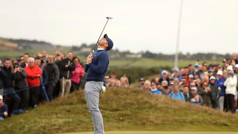 Northern Ireland's Rory McIlroy reacts on the green during day...