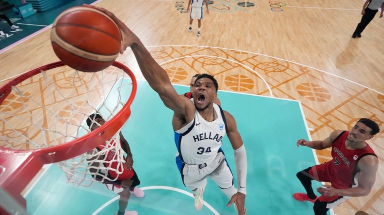 Giannis Antetokounmpo, of Greece, goes up for a dunk against...