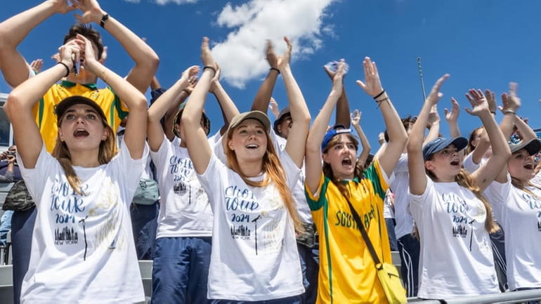 South Africa fans, part of a crowd of over 14,000,...