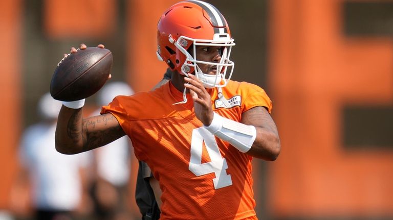 Cleveland Browns quarterback Deshaun Watson throws during an NFL football...