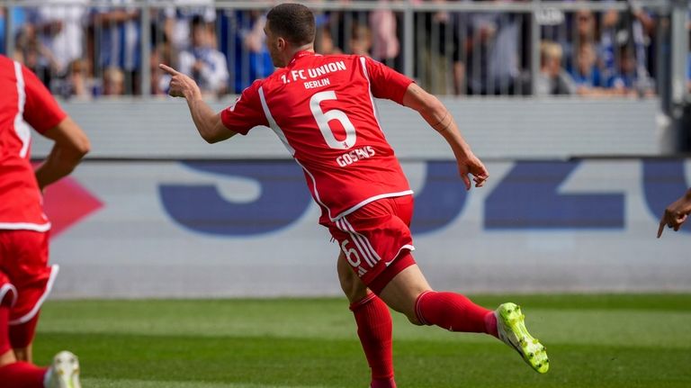 Union's Robin Gosens celebrates his side's opening goal during a...