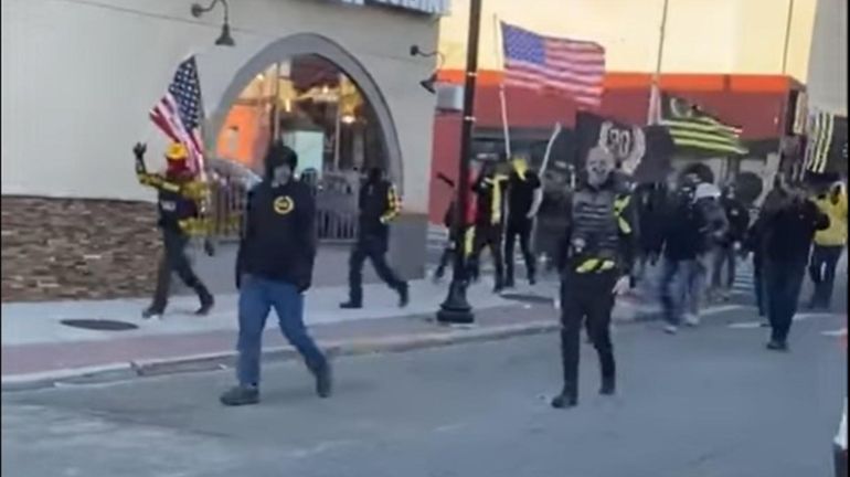 Members of the neo-fascist group the Proud Boys march through Rockville Centre...