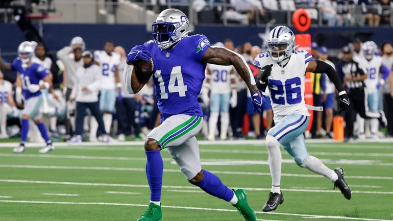 Seattle Seahawks wide receiver DK Metcalf (14) sprints to the...