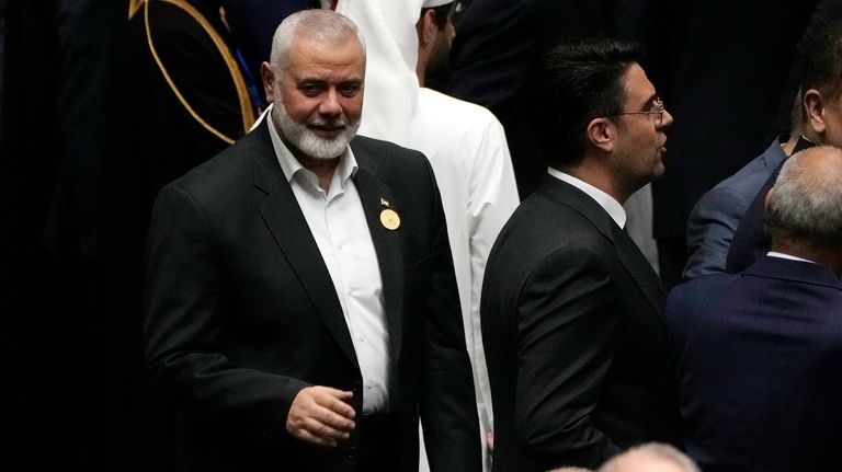 Hamas chief Ismail Haniyeh arrives at the Iranian parliament to...