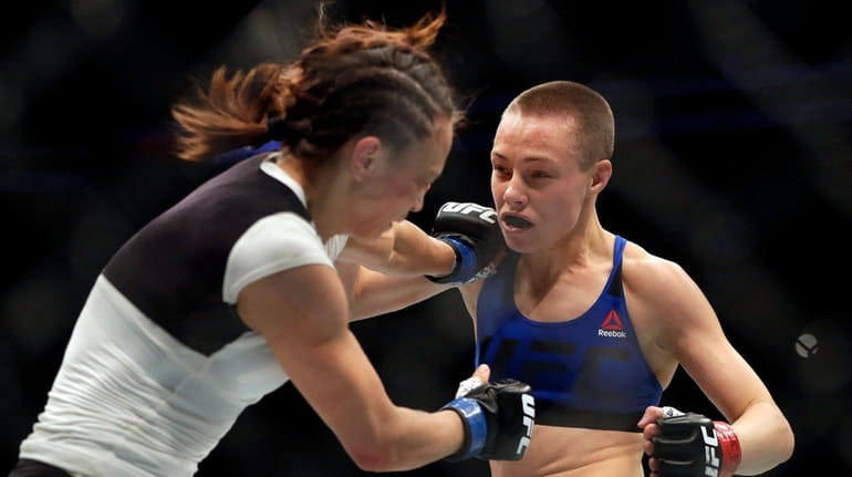 Rose Namajunas (right) battles Michelle Waterson during a women's strawweight...