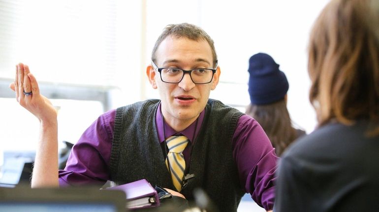 Evan Goldaper, 26, teaches his AP seminar class at Glen...