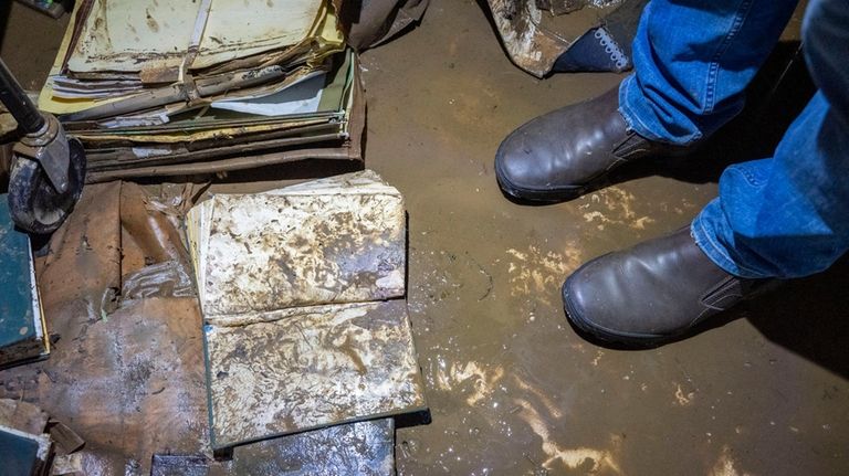 Floodwater-damaged books in the lower level of the Smithtown Library....