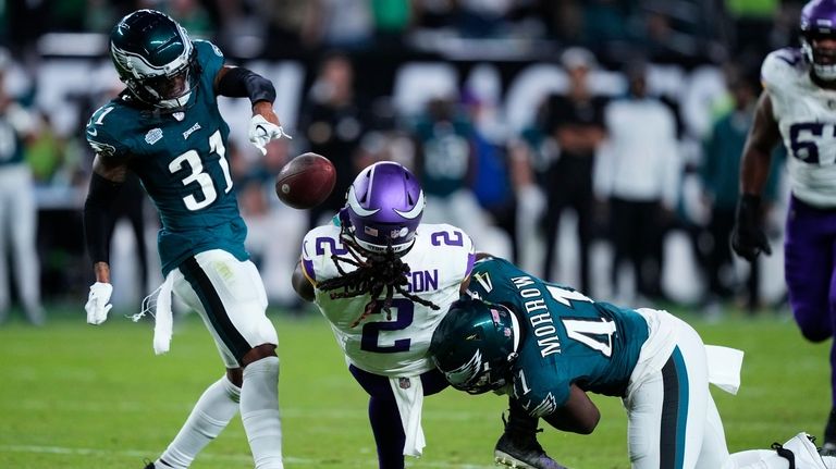 Minnesota Vikings running back Alexander Mattison (2) fumbles the ball...