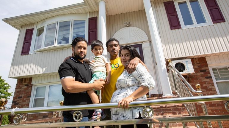 Sebastian Escobar and Jessica Betancur with sons Logan, 4, and Elijah, 13,...