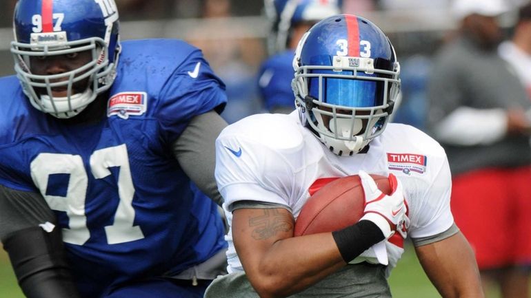 Da'Rel Scott (33) during NFL football training camp in Albany....