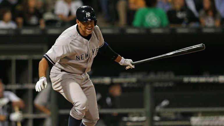 Alex Rodriguez reacts after flying out in the fourth inning...