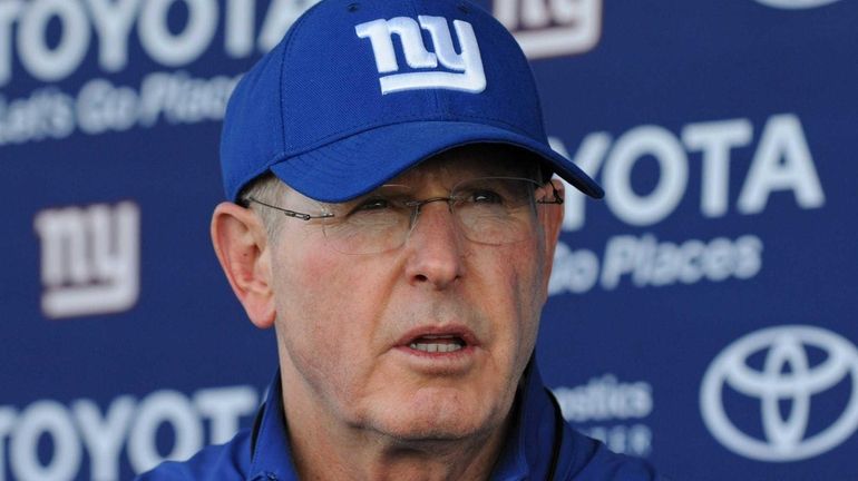 Tom Coughlin speaks to the media after a day of...