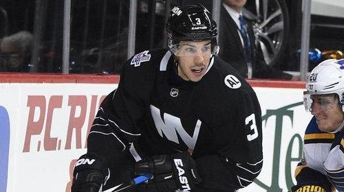 New York Islanders defenseman Travis Hamonic skates behind the net...