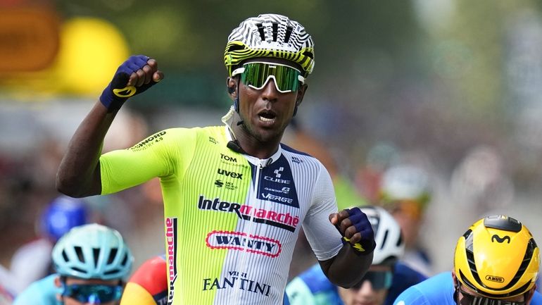 Eritrea's Biniam Girmay celebrates winning ahead of Colombia's Fernado Gavira,...