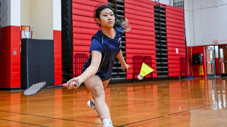 Kayla Wu of Great Neck South stretches for the return...