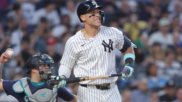 New York Yankees designated hitter Aaron Judge (99) reacts after...