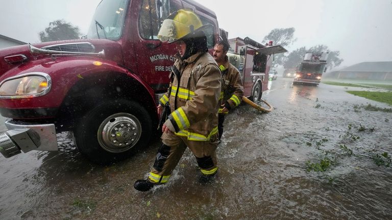 Morgan City firefighters respond to a home fire during Hurricane...