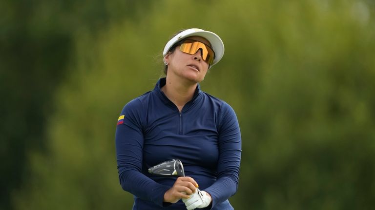 Maria Jose Uribe, of Colombia, reacts after het tee shot...